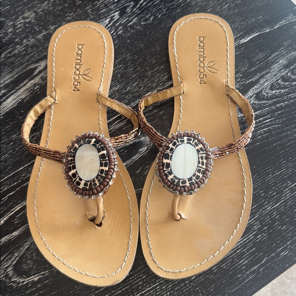 Bamboo54 earth tone sequined and opal sandals.